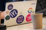 Photo: Laptop with many stickers, including UNIC.